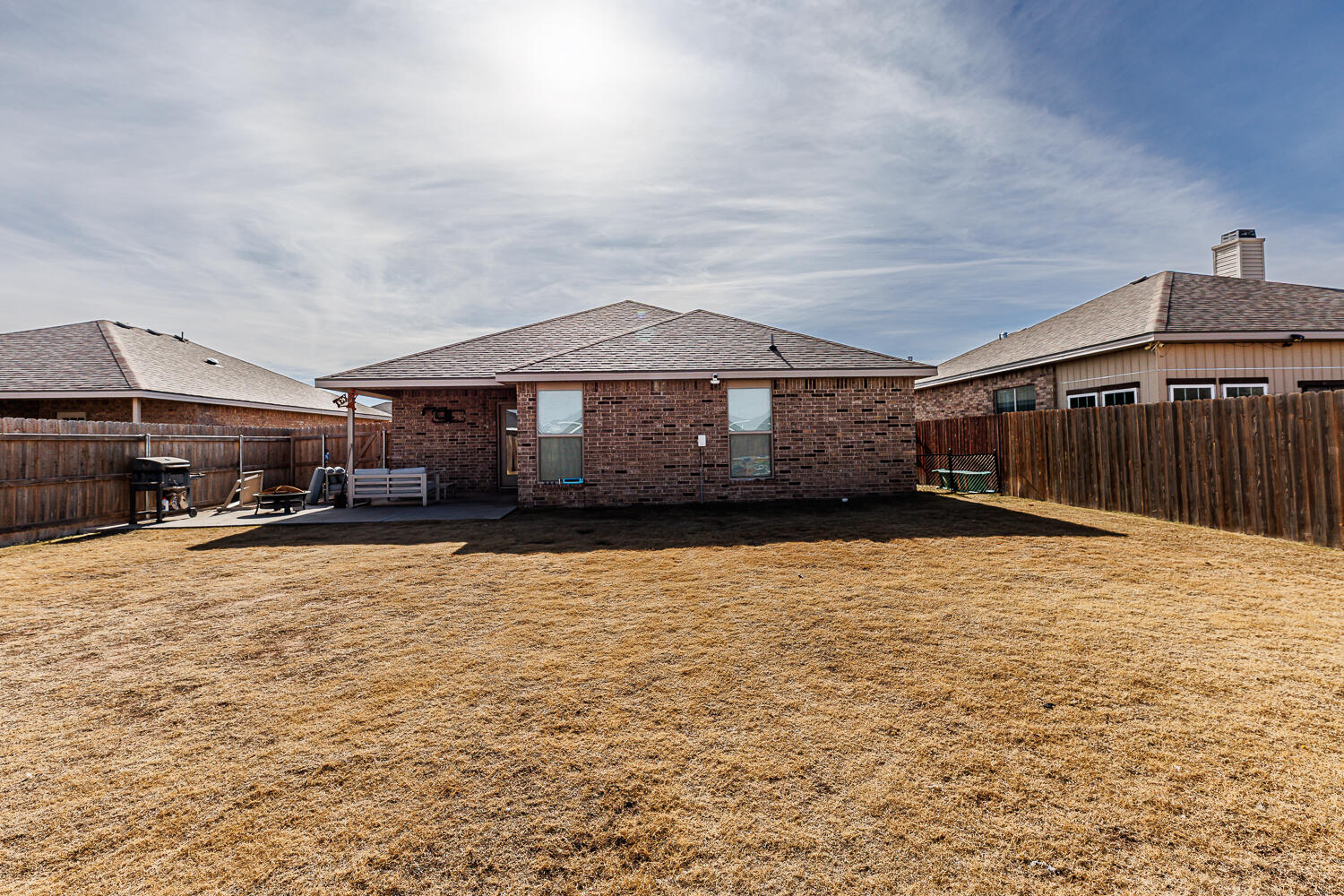 7322 29th Street Lubbock, TX 79407 - Photo 33 of 40 a front view of a house with a yard