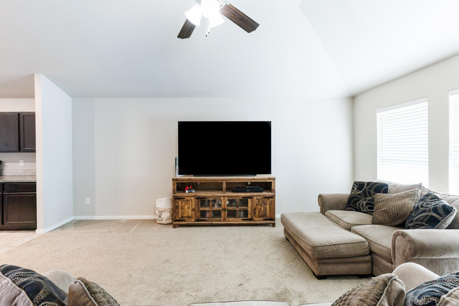 7322 29th Street Lubbock, TX 79407 - Photo 6 of 40 a living room with furniture and a flat screen tv