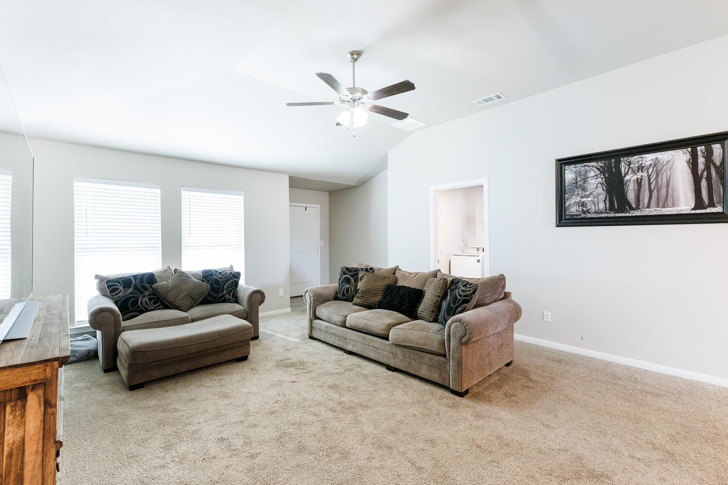 7322 29th Street Lubbock, TX 79407 - Photo 8 of 40 a living room with furniture and a window