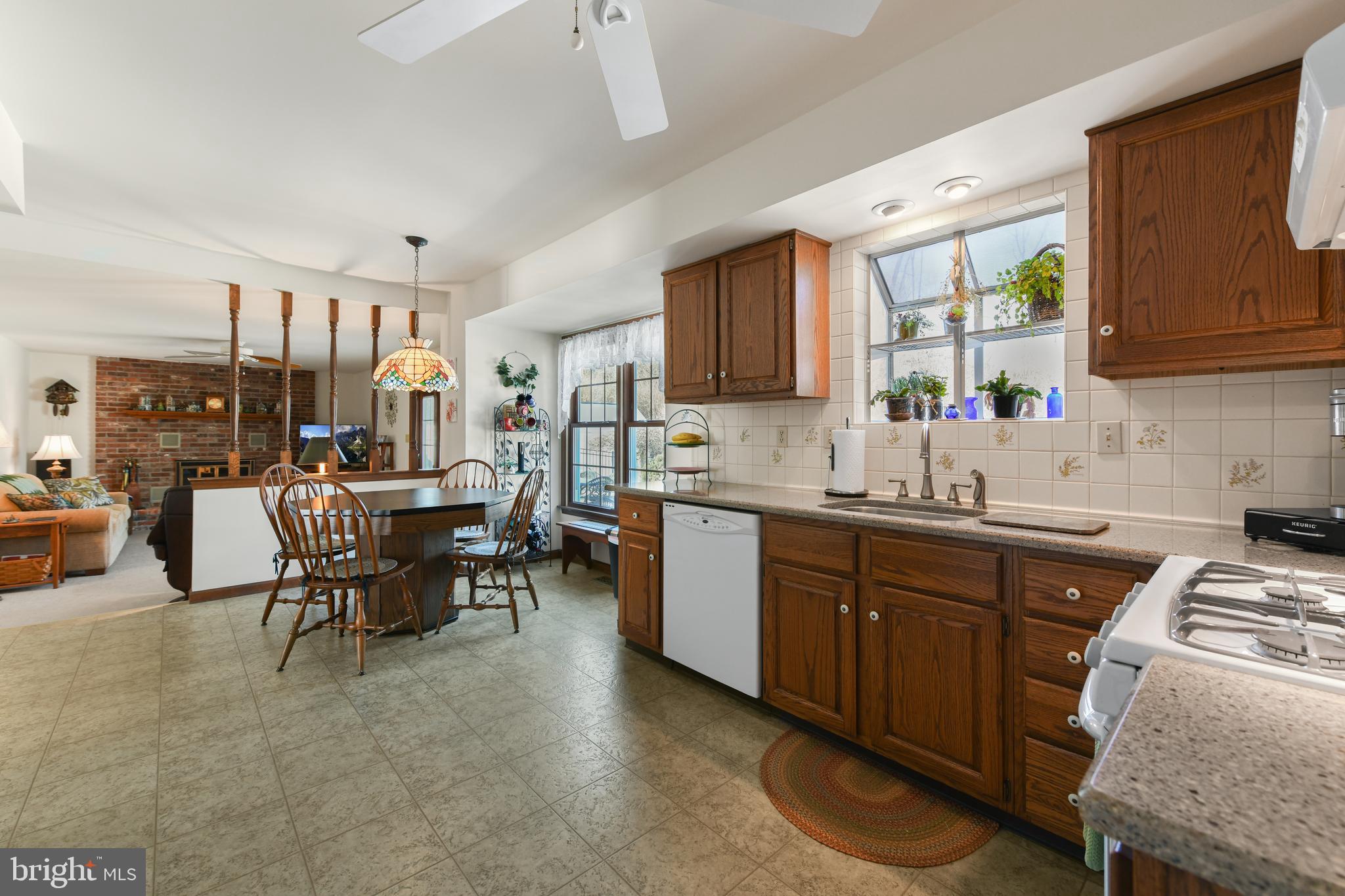13 Marie Drive Sinking Spring, PA 19608 - Photo 12 of 55 a kitchen with sink a chair and cabinets