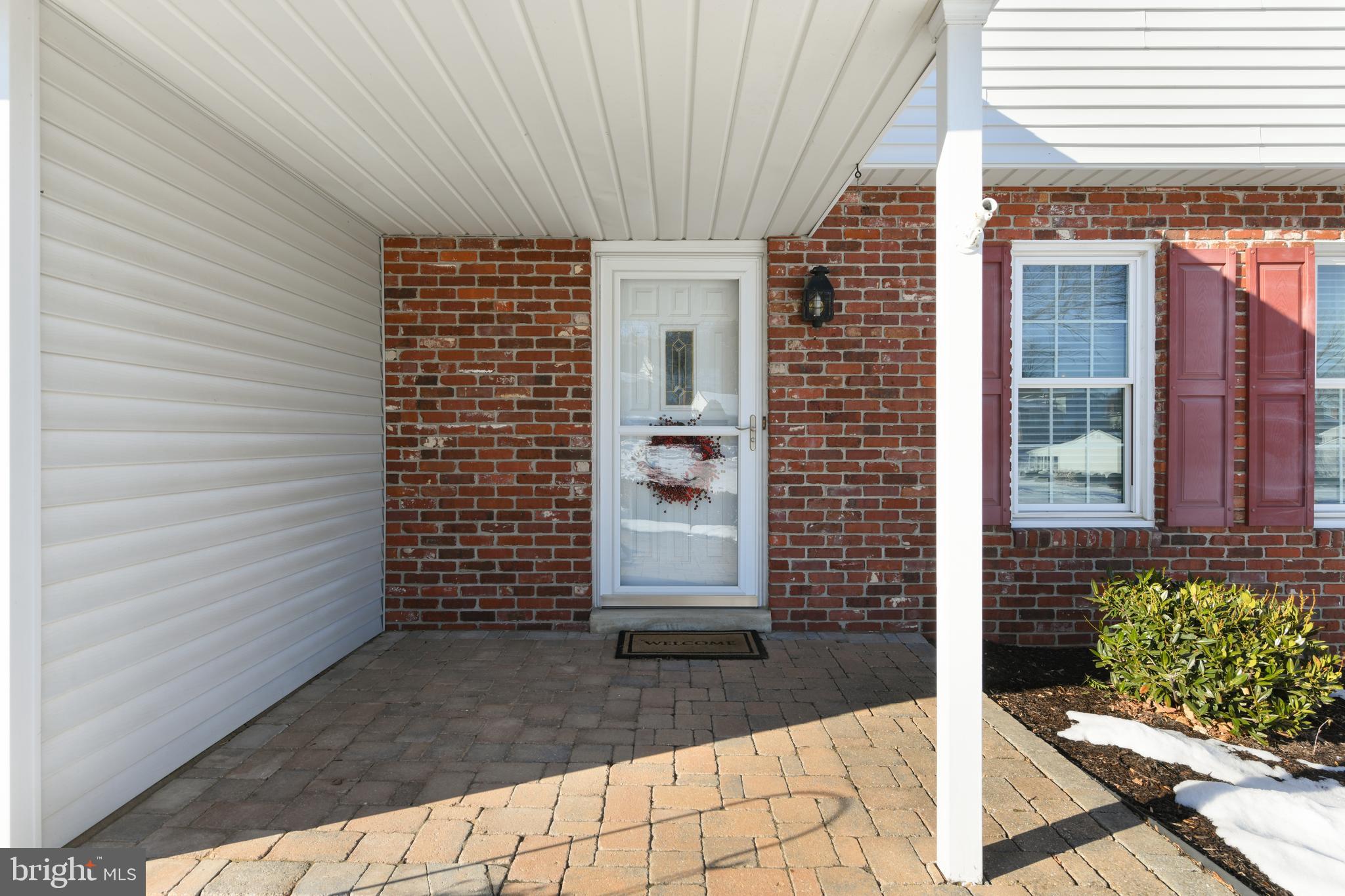 13 Marie Drive Sinking Spring, PA 19608 - Photo 51 of 55 a view of a brick house with potted plants
