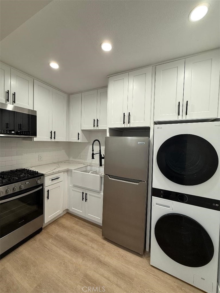 14352 A Flomar Drive Whittier, CA 90603 - Photo 3 of 10 a kitchen with a refrigerator sink and cabinets