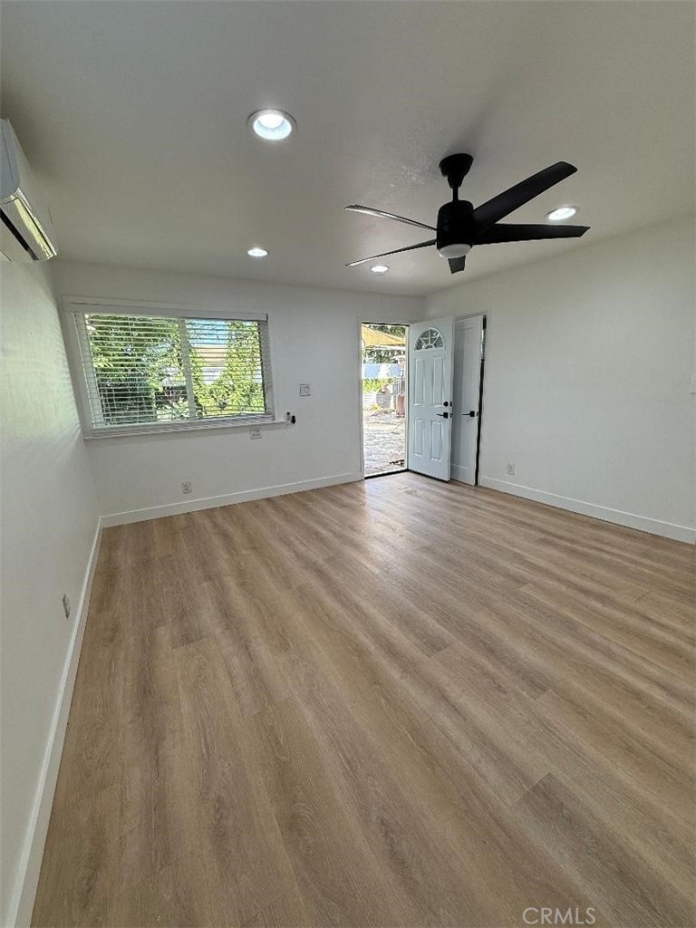 14352 A Flomar Drive Whittier, CA 90603 - Photo 5 of 10 wooden floor in an empty room with a window