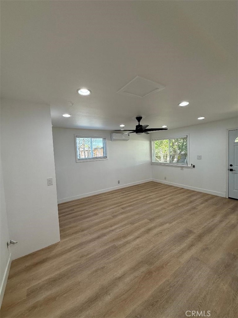 14352 A Flomar Drive Whittier, CA 90603 - Photo 6 of 10 an empty room with windows and entrance