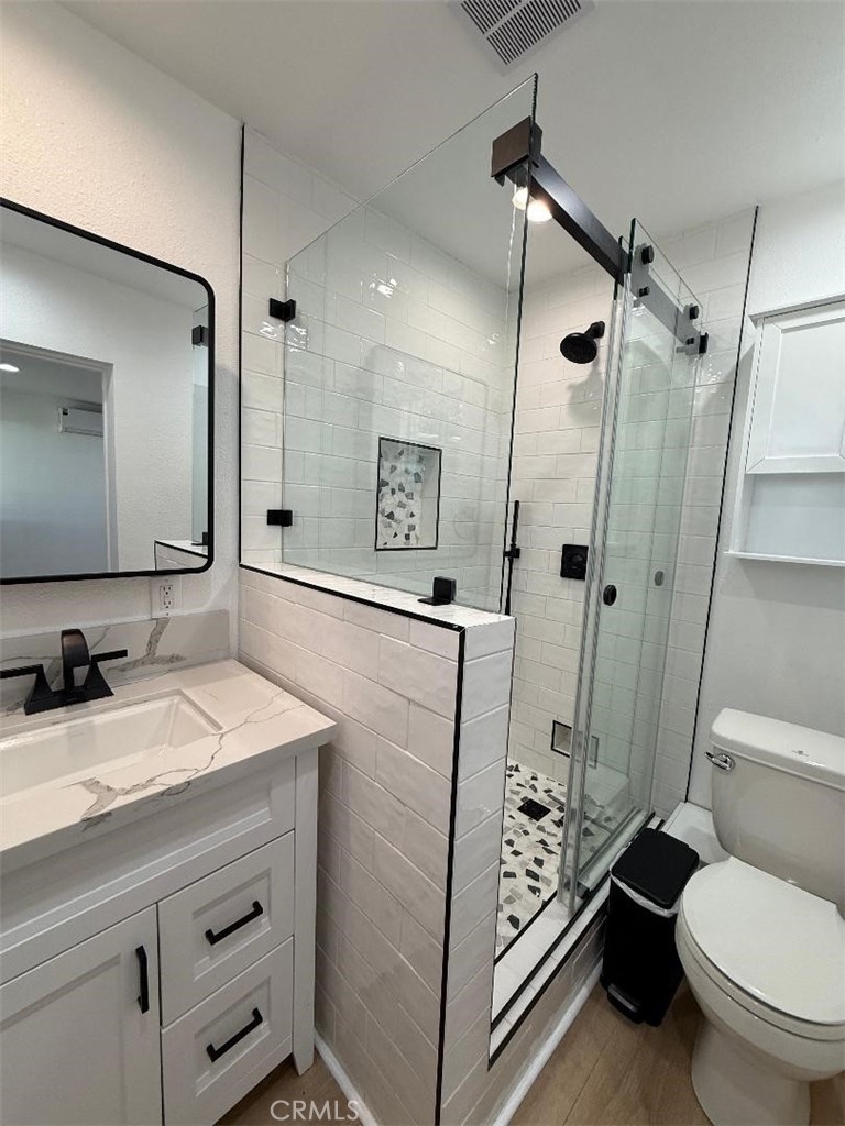 14352 A Flomar Drive Whittier, CA 90603 - Photo 8 of 10 a bathroom with a granite countertop sink toilet and shower
