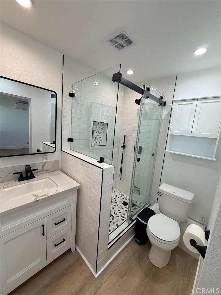 14352 A Flomar Drive Whittier, CA 90603 - Photo 9 of 10 a bathroom with a granite countertop sink toilet and shower