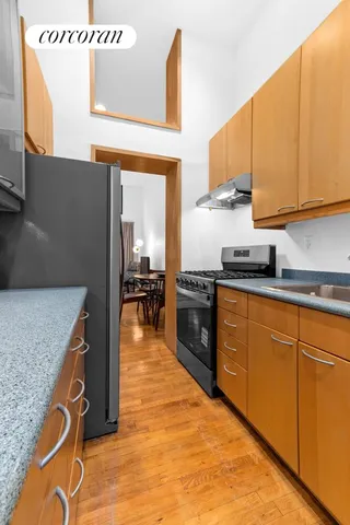 a bedroom with a bed and chair