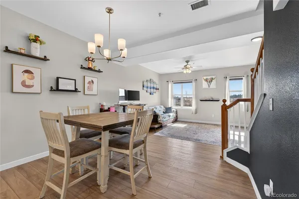 a view of a dining room with furniture and wooden floor