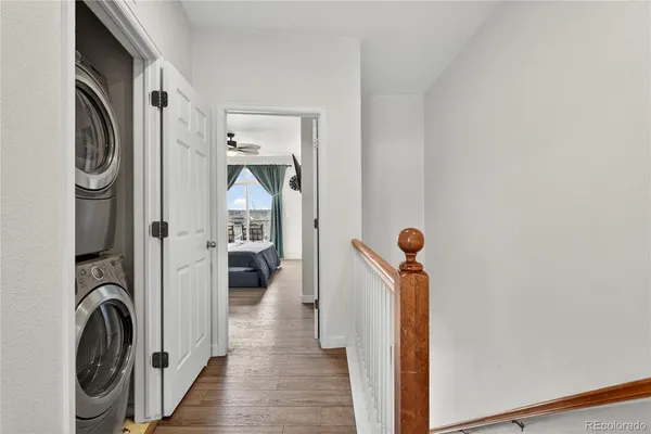 a bedroom with a bed and a flat tv screen on dresser