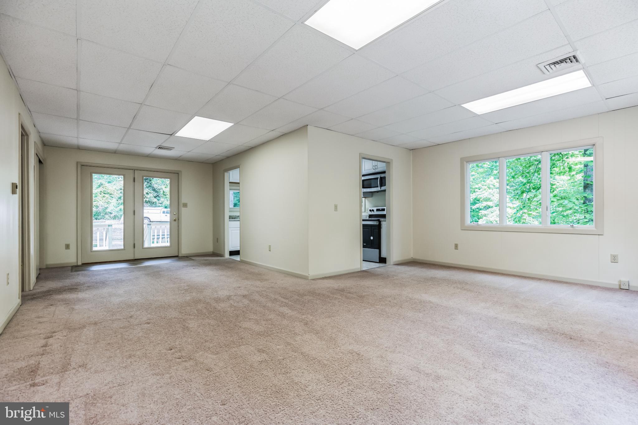 11425 Mill Bridge Road Lusby, MD 20657 - Photo 9 of 40 an empty room with windows and closet