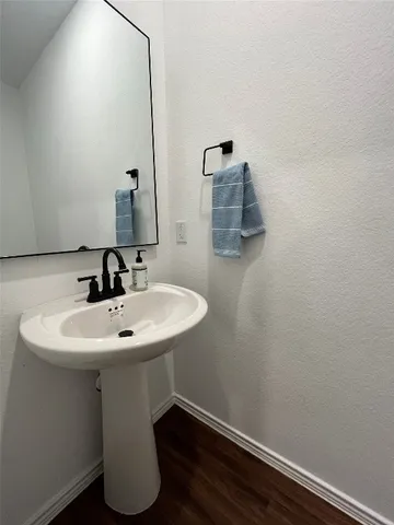 a bathroom with a sink and mirror