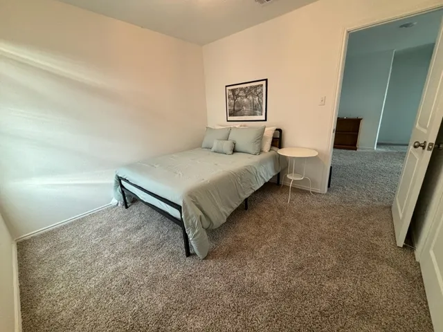 a bed room with a bed and a couch