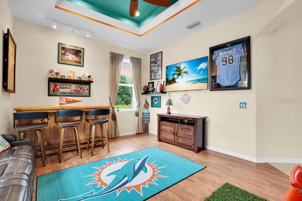 3336 Lakeside Circle Parrish, FL 34219 - Photo 11 of 49 a living room with furniture and a wooden floor