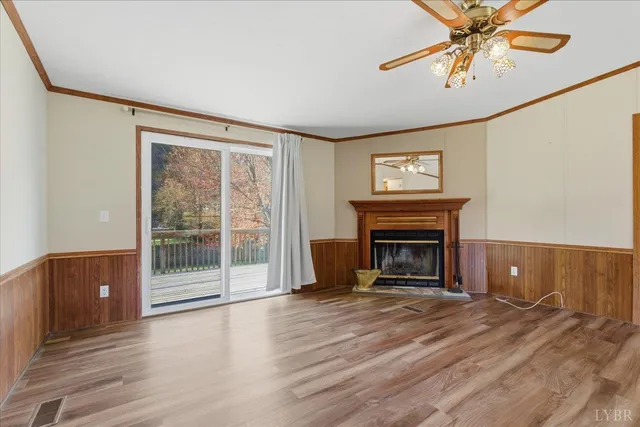 a view of a livingroom with a fireplace and window