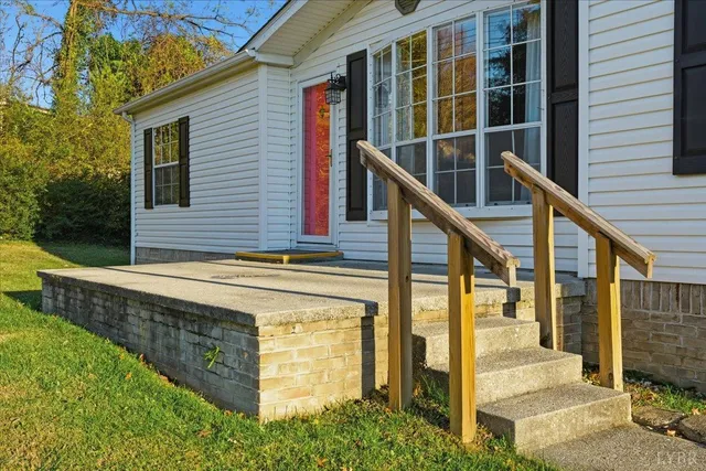 a view of balcony with wooden floor and fence