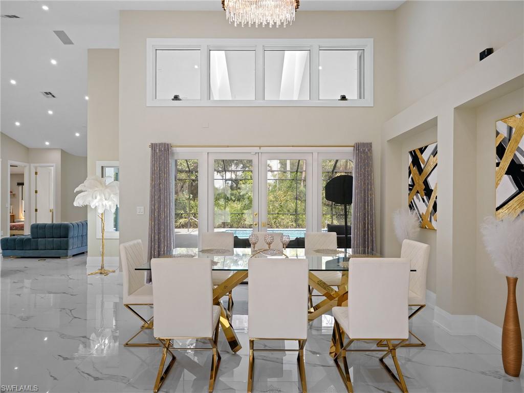 2140 Harlans Run Naples, FL 34105 - Photo 14 of 37 a view of a dining room with furniture window and outside view