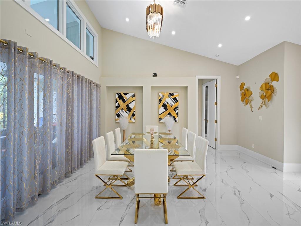 2140 Harlans Run Naples, FL 34105 - Photo 15 of 37 a view of a dining room with furniture and a window