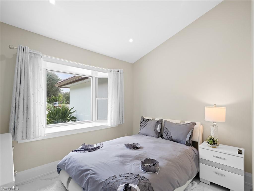 2140 Harlans Run Naples, FL 34105 - Photo 29 of 37 a bedroom with a bed and a window