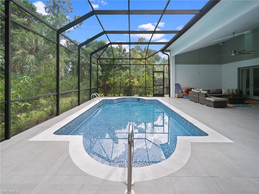 2140 Harlans Run Naples, FL 34105 - Photo 32 of 37 a view of a couches in the balcony