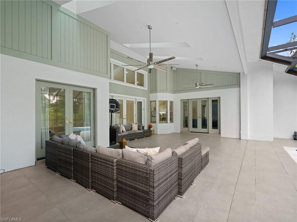 2140 Harlans Run Naples, FL 34105 - Photo 33 of 37 a bed room with furniture and a chandelier