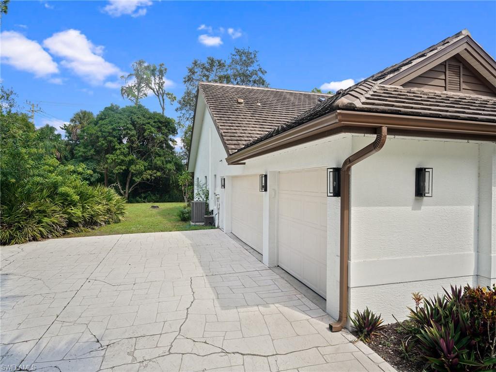 2140 Harlans Run Naples, FL 34105 - Photo 36 of 37 a view of house with garden