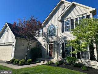 229 Barnhill Road Perkasie, PA 18944 - Photo 1 of 66 a front view of a house with a yard and potted plants