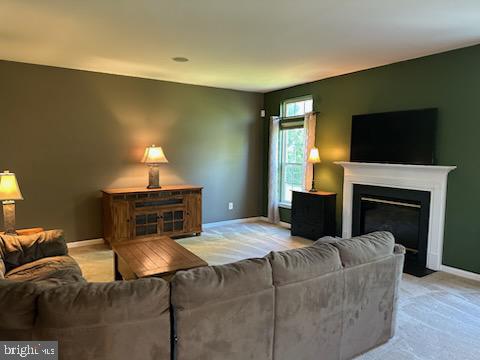 229 Barnhill Road Perkasie, PA 18944 - Photo 14 of 66 a living room with furniture a fireplace and a flat screen tv