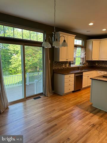 229 Barnhill Road Perkasie, PA 18944 - Photo 23 of 66 a kitchen with stainless steel appliances granite countertop a stove and a wooden floors