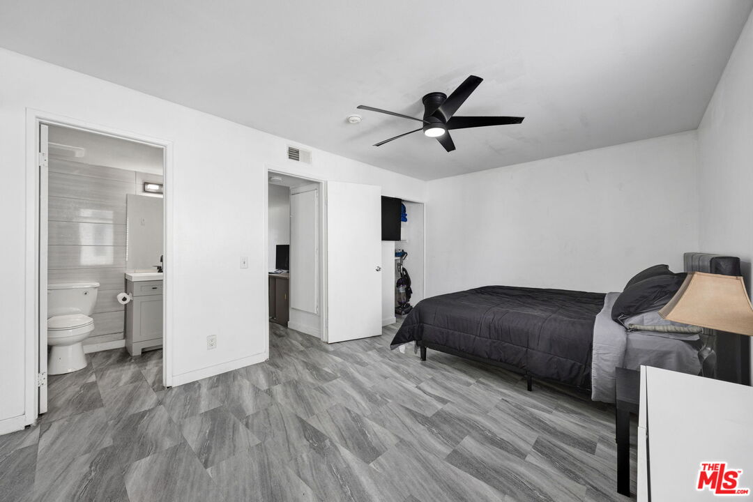 12330 Osborne Street, Unit 77 Pacoima, CA 91331 - Photo 11 of 32 a room with a bed and a view of bathroom