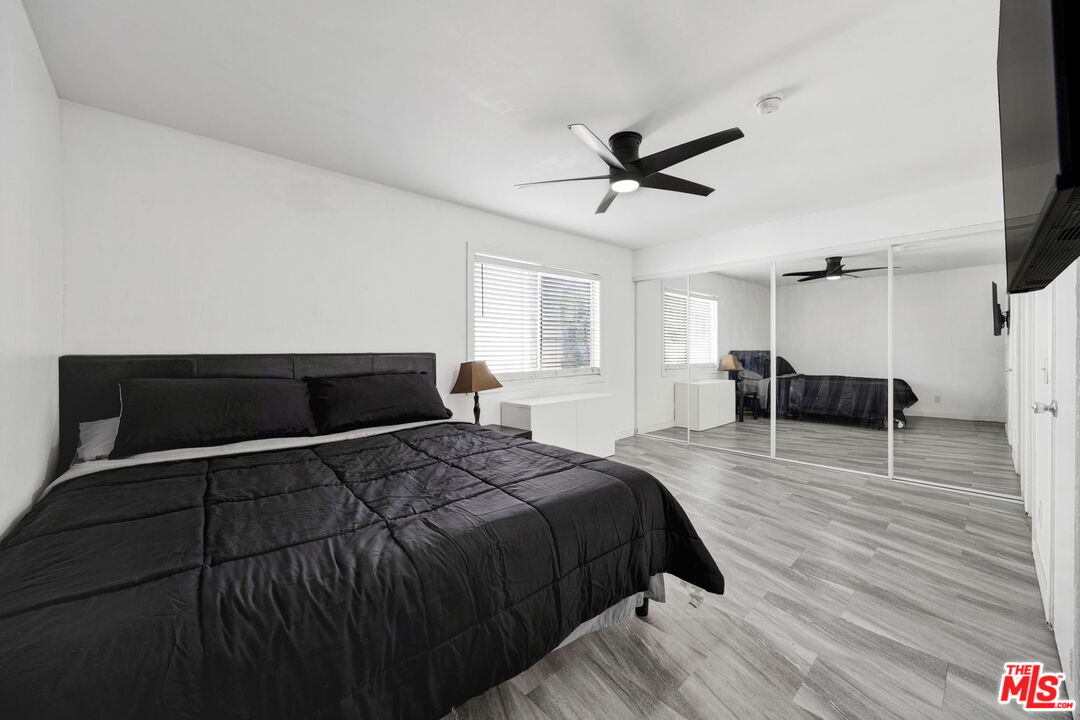 12330 Osborne Street, Unit 77 Pacoima, CA 91331 - Photo 14 of 32 a bedroom with a bed and furniture