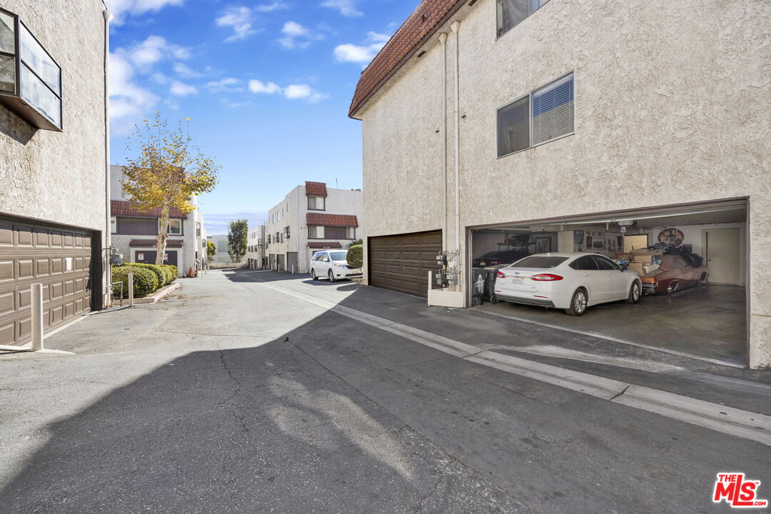 12330 Osborne Street, Unit 77 Pacoima, CA 91331 - Photo 18 of 32 a car parked on the side of a street