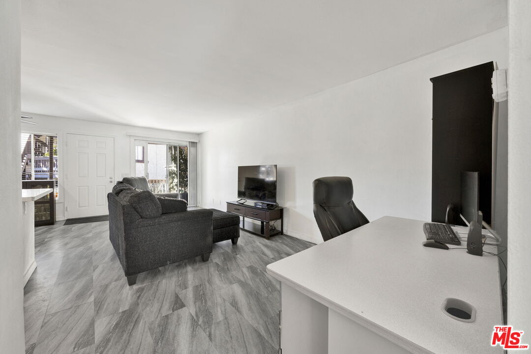 12330 Osborne Street, Unit 77 Pacoima, CA 91331 - Photo 6 of 32 a living room with furniture and a flat screen tv