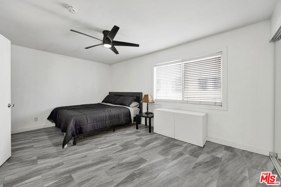 12330 Osborne Street, Unit 77 Pacoima, CA 91331 - Photo 10 of 32 a bedroom with a bed and a window