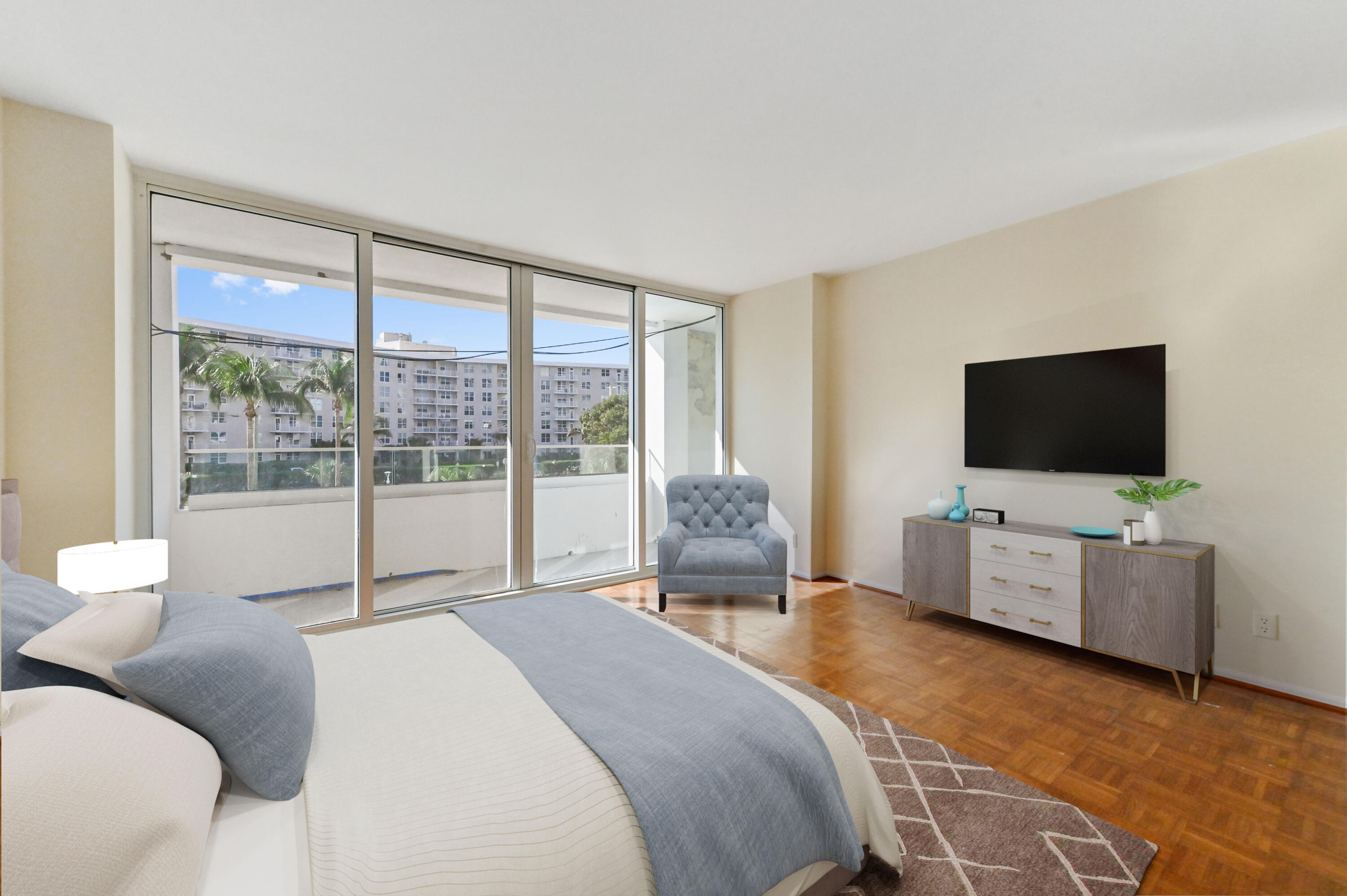 2800 South Ocean Boulevard, Unit 2K Boca Raton, FL 33432 - Photo 22 of 59 a bedroom with a flat screen television and a bed