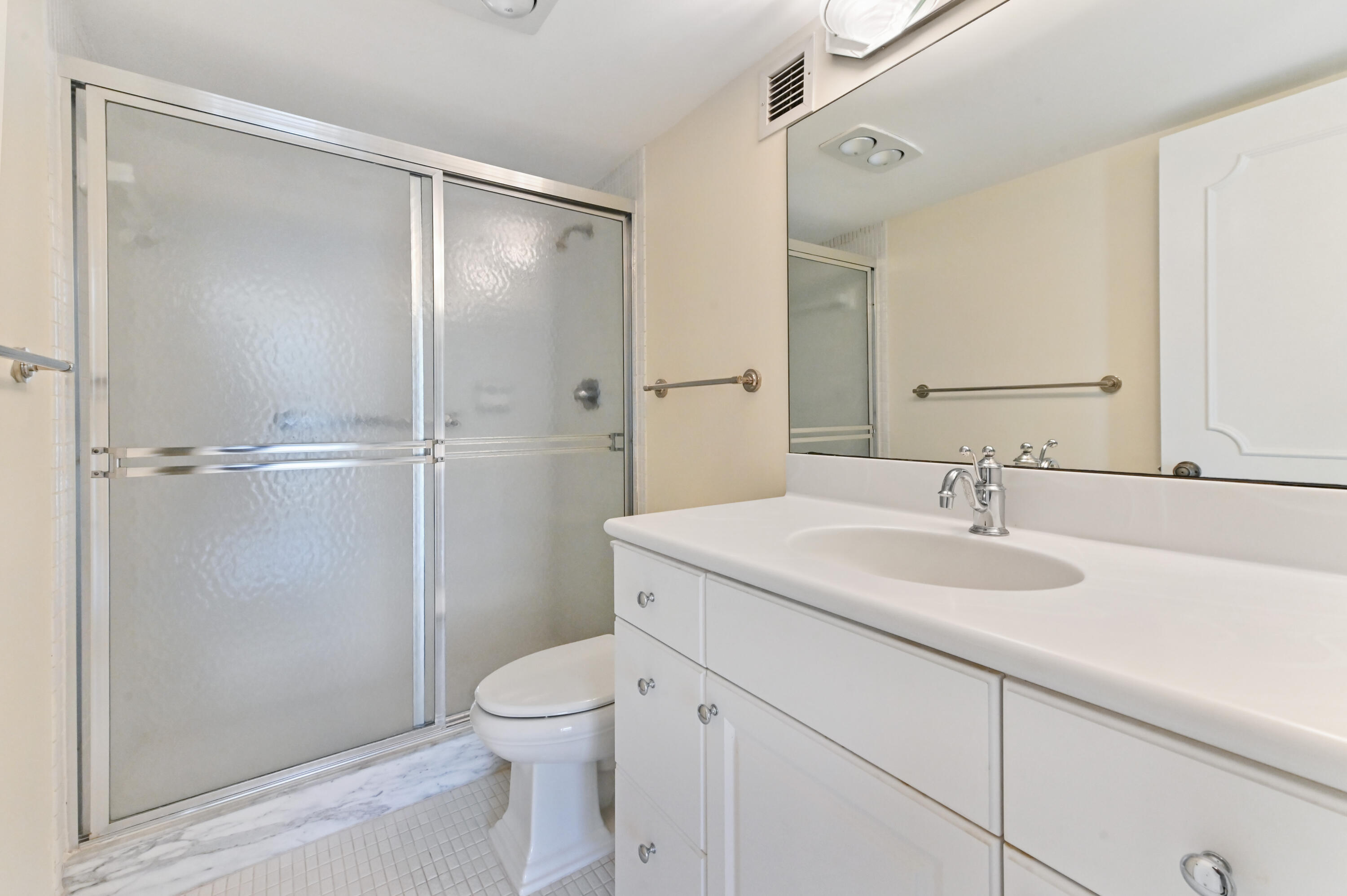 2800 South Ocean Boulevard, Unit 2K Boca Raton, FL 33432 - Photo 24 of 59 a bathroom with a sink toilet and shower