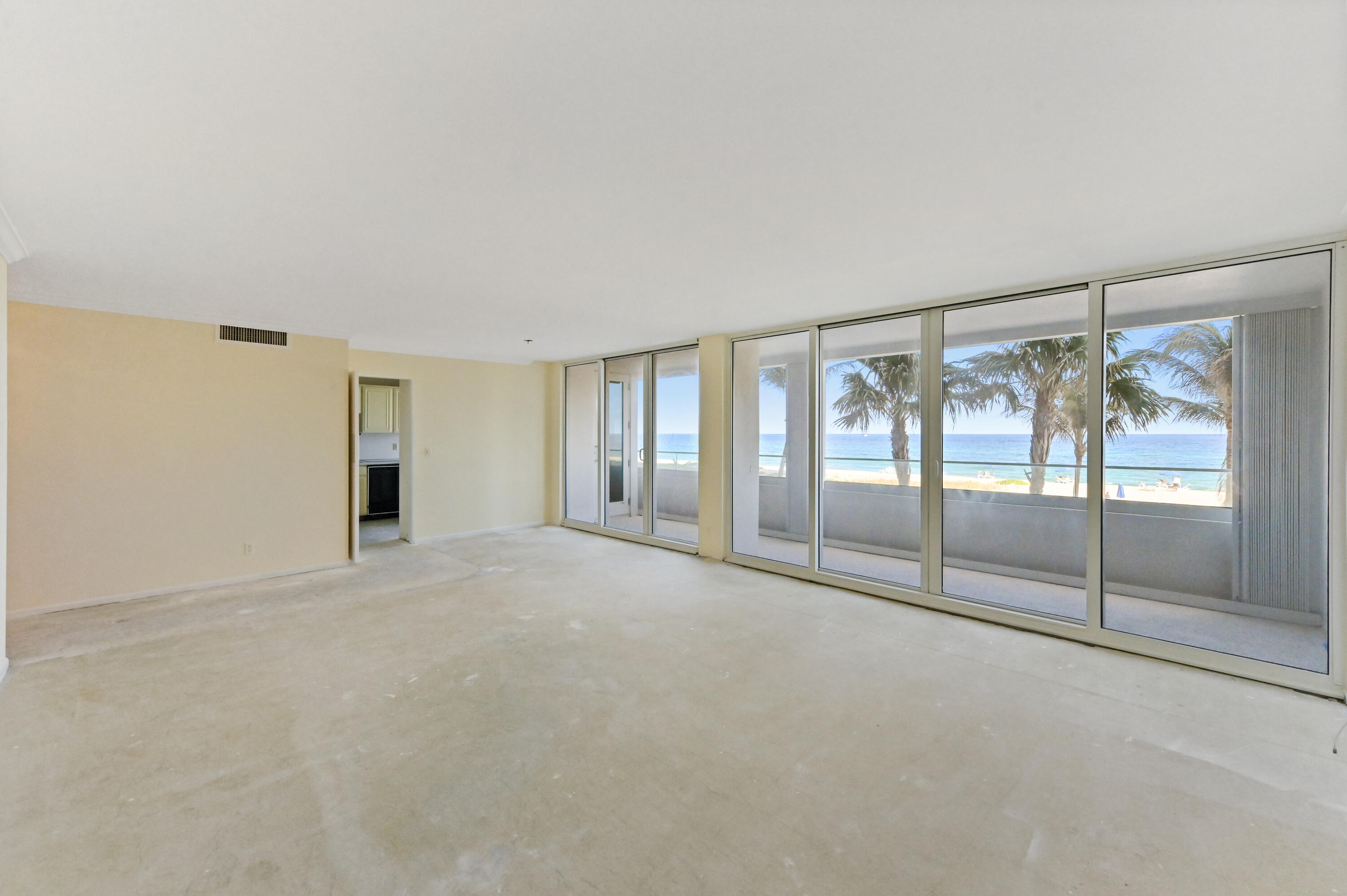 2800 South Ocean Boulevard, Unit 2K Boca Raton, FL 33432 - Photo 6 of 59 a view of an empty room with sliding glass door
