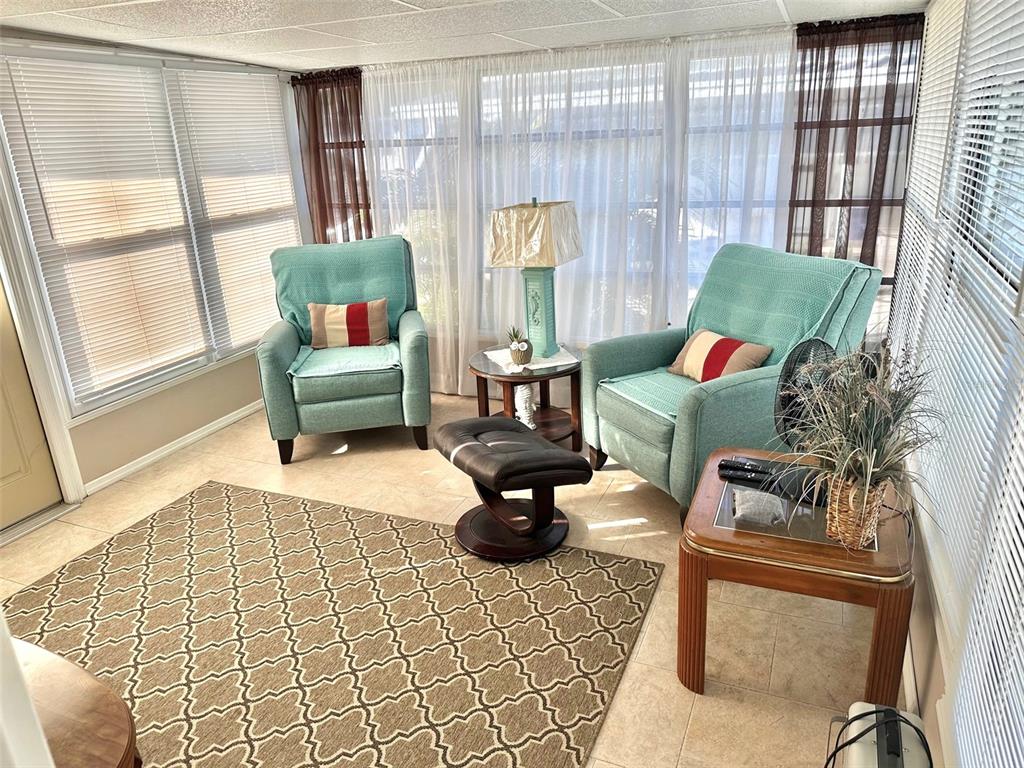 9900 Ulmerton Road, Unit 61 Largo, FL 33771 - Photo 12 of 17 a living room with furniture and a large window
