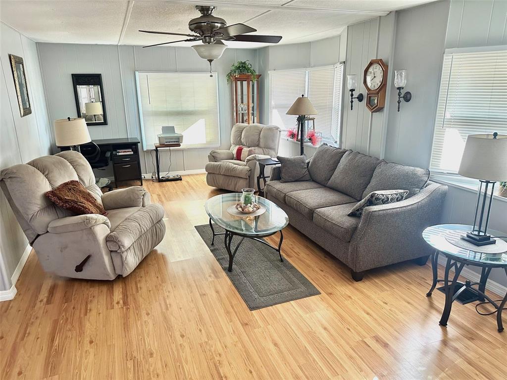 9900 Ulmerton Road, Unit 61 Largo, FL 33771 - Photo 6 of 17 a living room with furniture and a wooden floor
