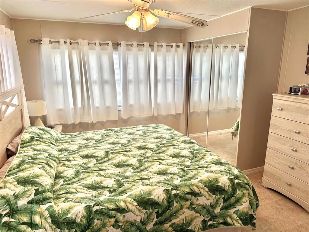 9900 Ulmerton Road, Unit 61 Largo, FL 33771 - Photo 9 of 17 a bedroom with a bed and a window