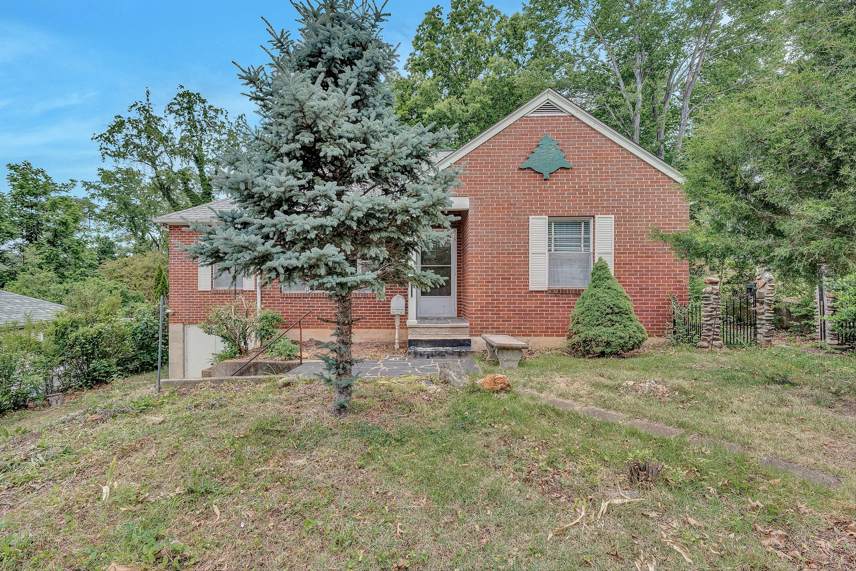 1917 Langdon Road Southwest Roanoke, VA 24015 - Photo 1 of 42 a front view of a house with a yard