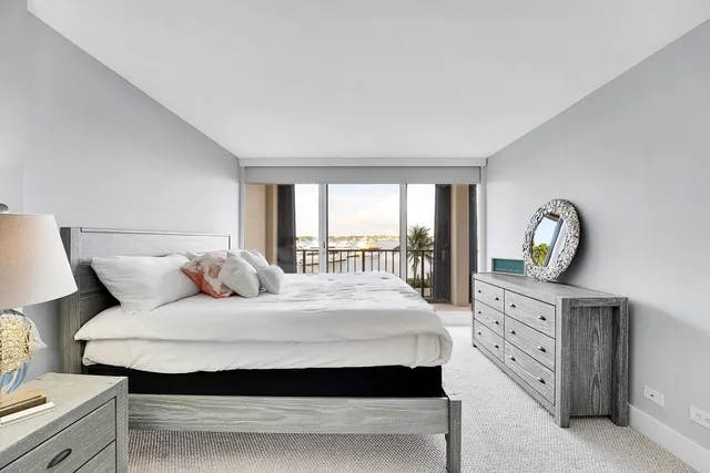 a bedroom with a large bed and a table