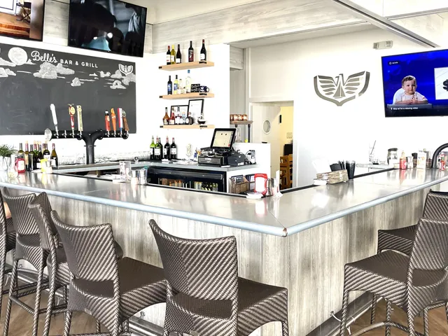 a view of a cafe with sitting area