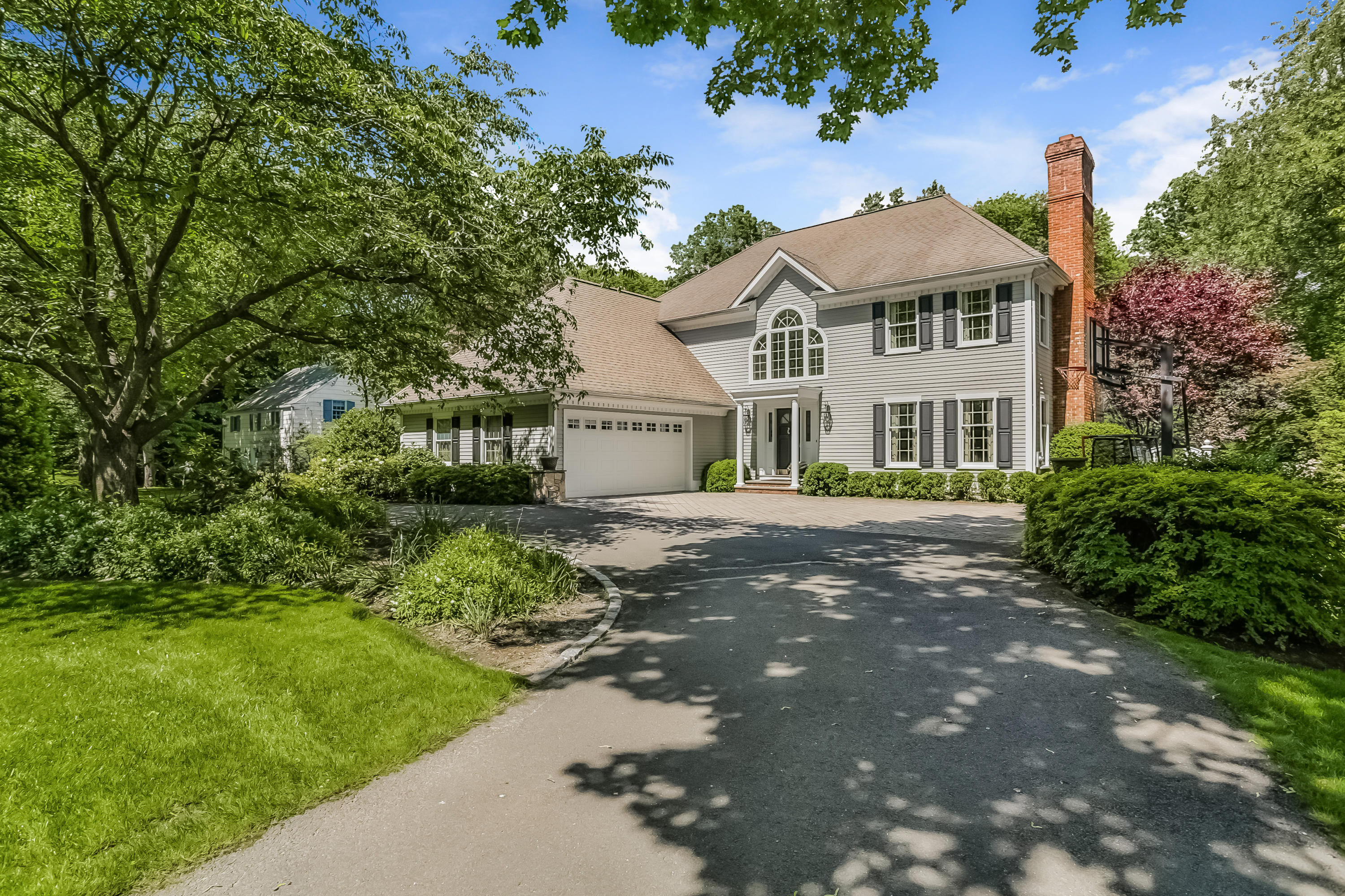 24 Birch Road Darien, CT 06820 - Photo 1 of 20 a front view of a house with a yard