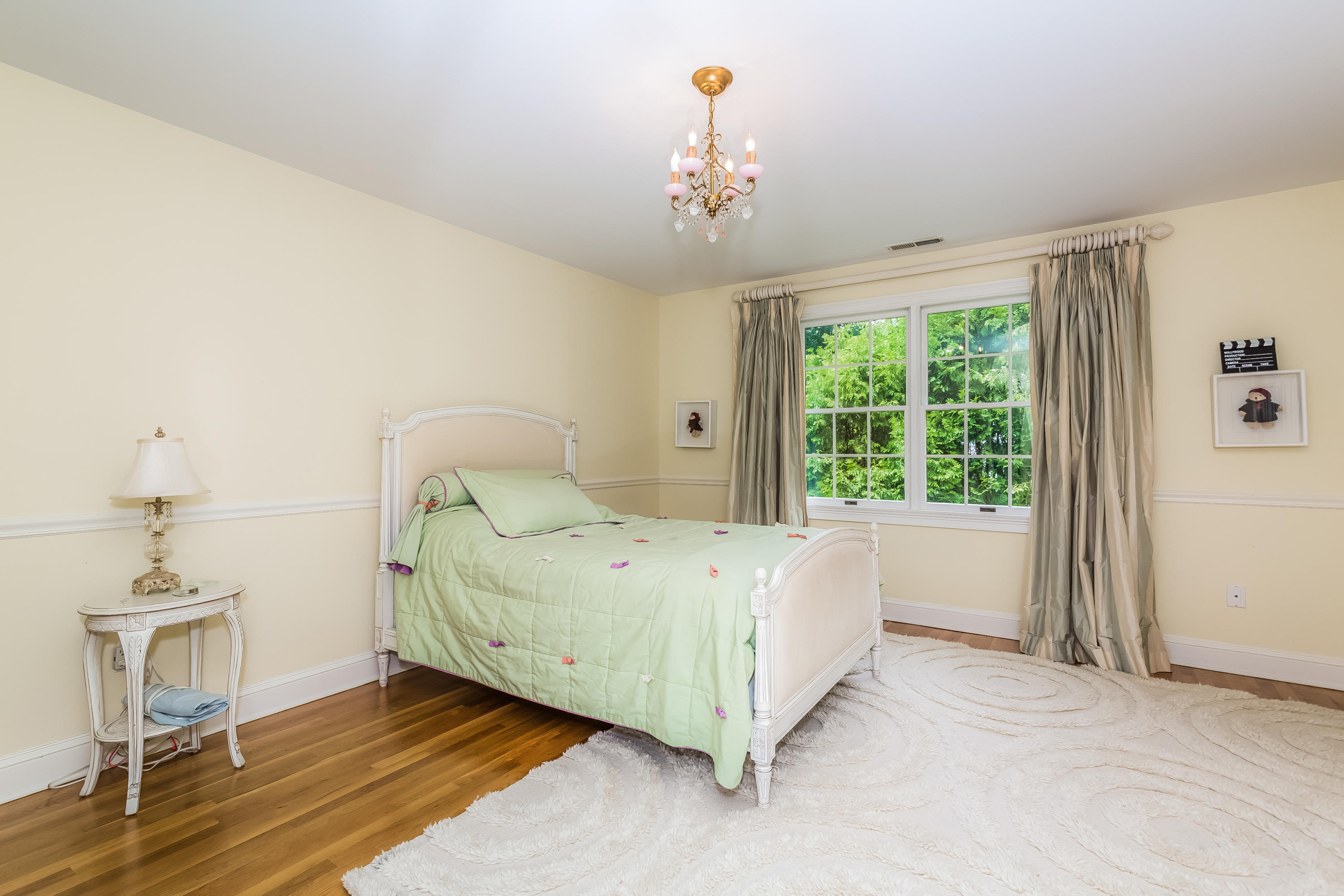 24 Birch Road Darien, CT 06820 - Photo 14 of 20 a bed sitting in a spacious bedroom next to a window
