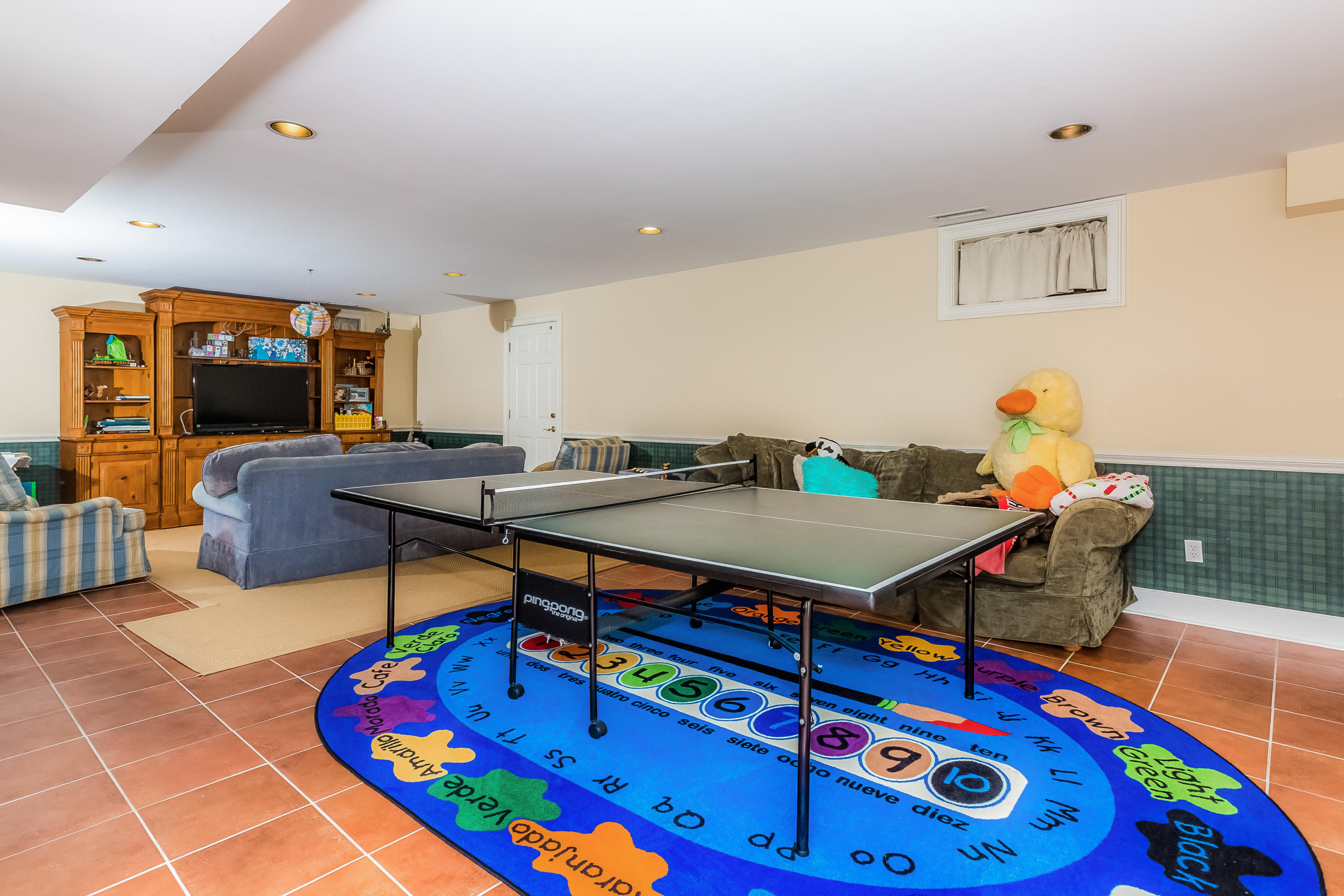 24 Birch Road Darien, CT 06820 - Photo 17 of 20 a living room with furniture and a pool table
