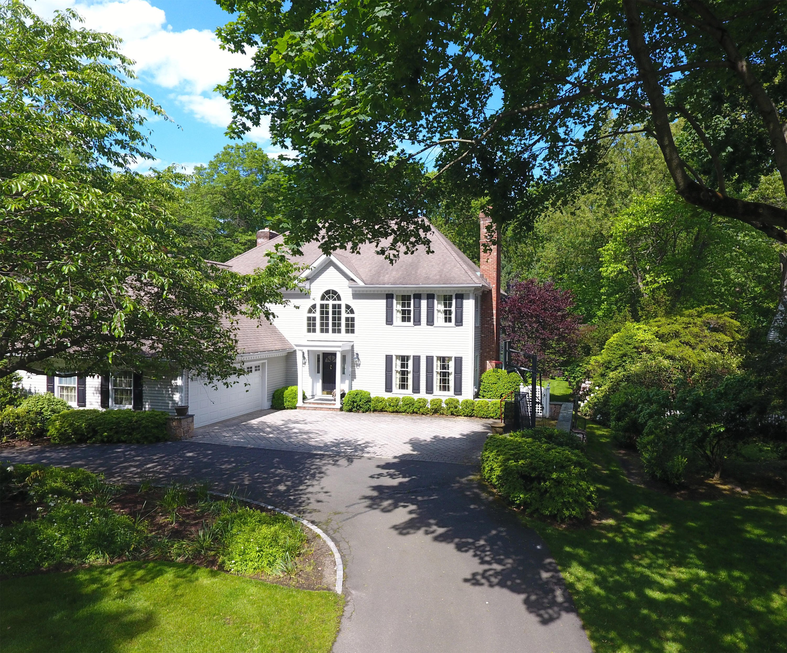 24 Birch Road Darien, CT 06820 - Photo 20 of 20 a front view of a house with a garden