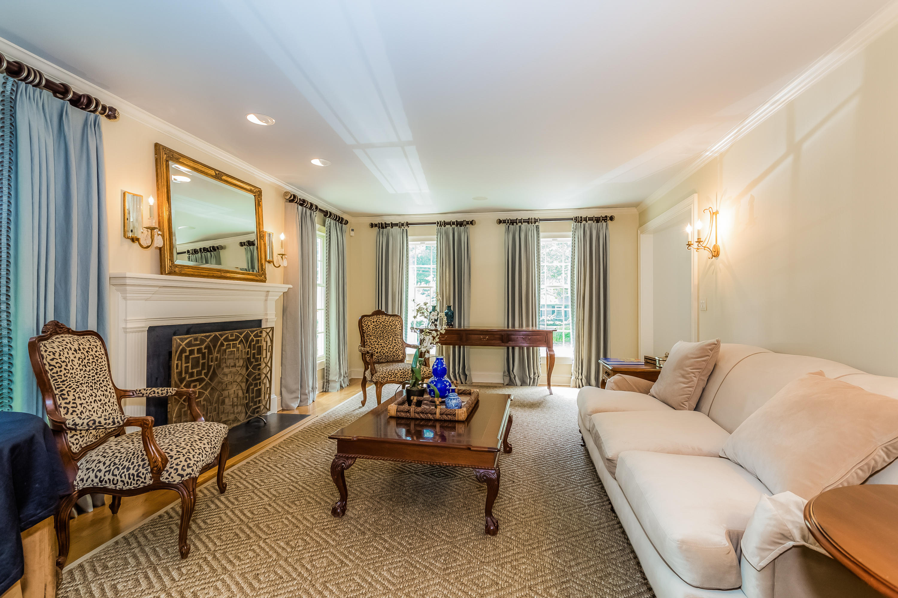 24 Birch Road Darien, CT 06820 - Photo 4 of 20 a living room with furniture and a fireplace