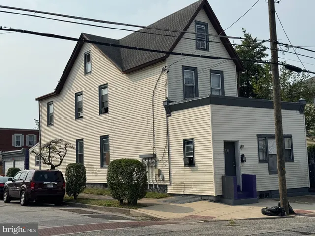a view of a house with a street