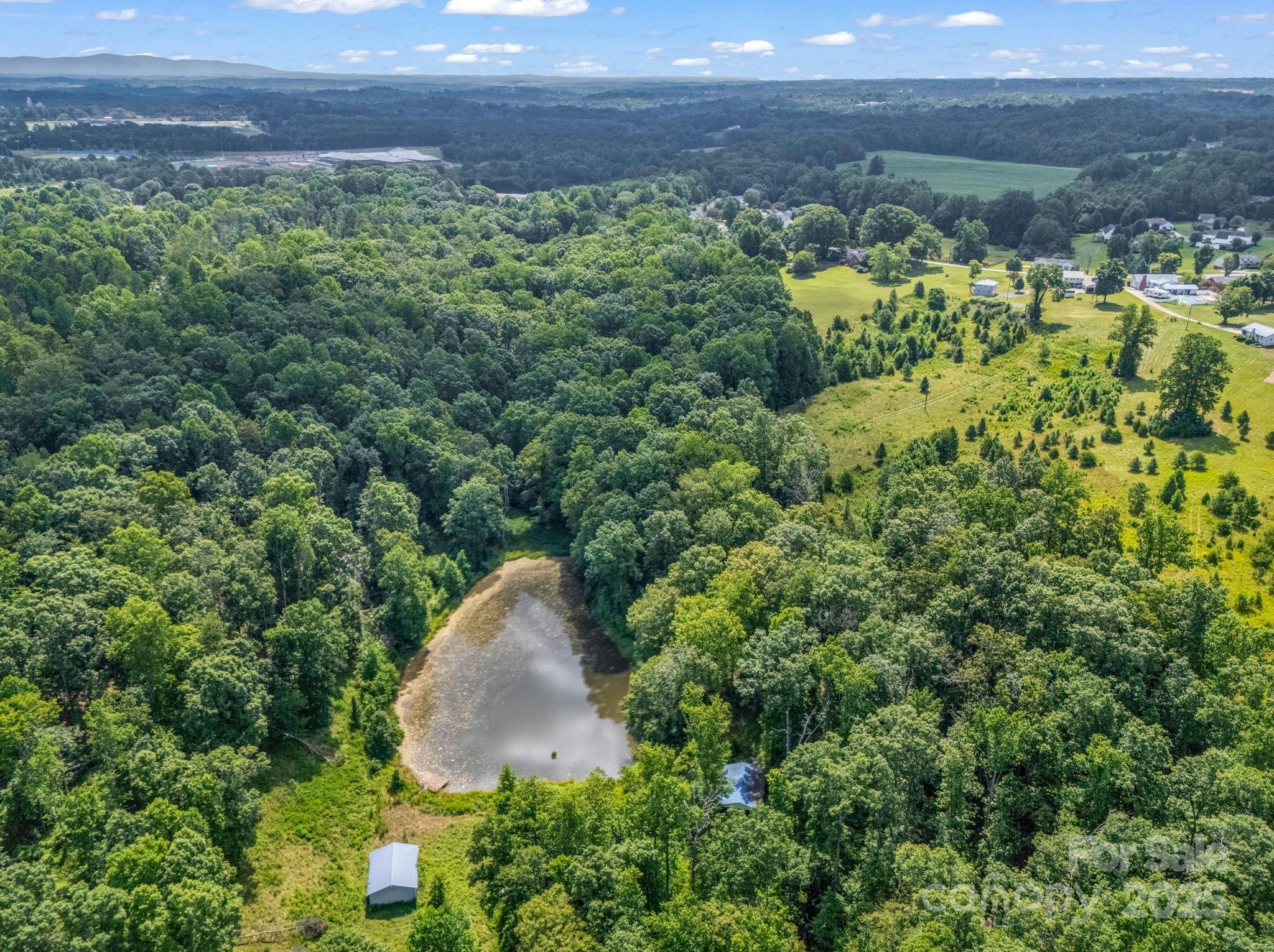 0 Us 64/74a Highway Rutherfordton, NC 28139 - Photo 34 of 37 a view of a yard with plants and a bench