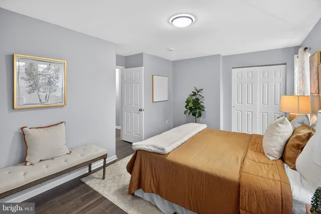 a bedroom with a bed and chair